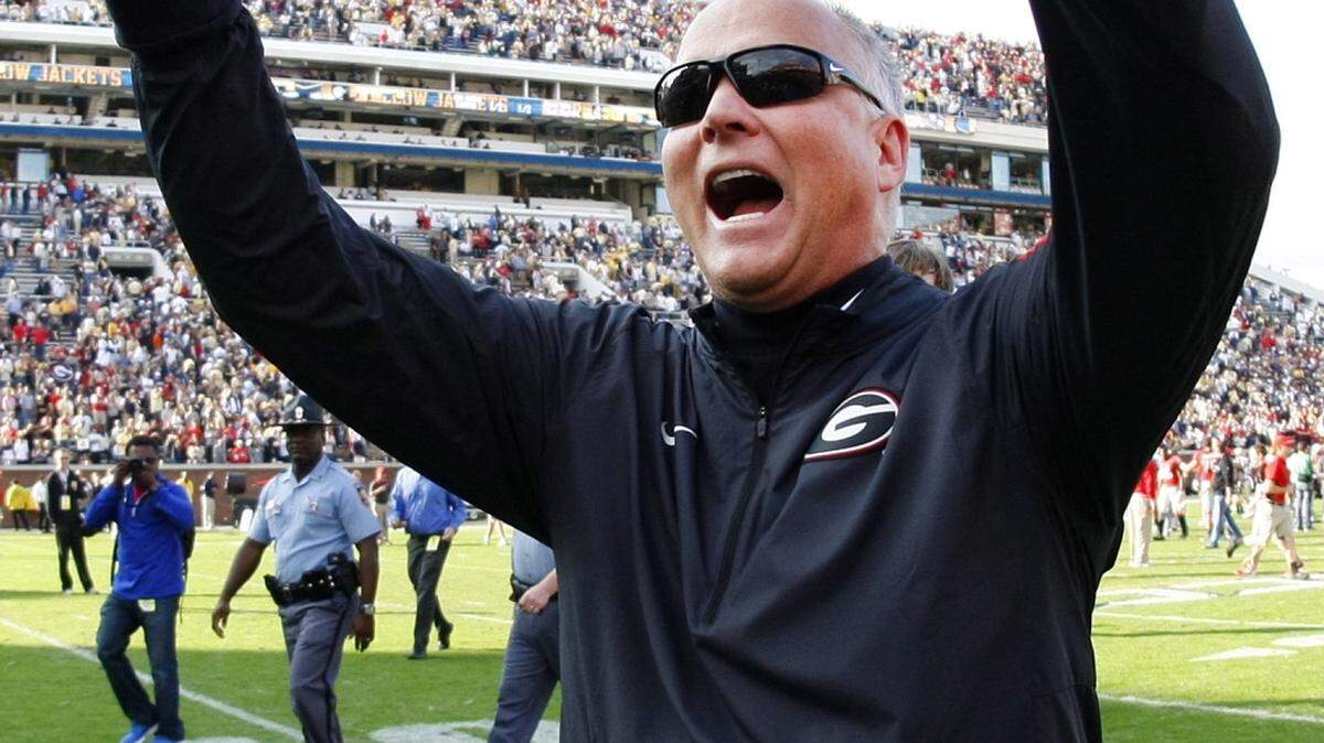 Georgia head coach Mark Richt celebrates as he walks off the field after they defeated Georgia Tech 13-7 in an NCAA college football game Saturday, Nov. 28, 2015, in Atlanta. (AP Photo/Brett Davis)