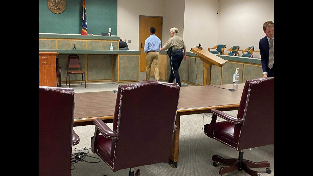 Ex-Moss Point police officer is escorted out of Jackson County Circuit Court after Judge Dale Harkey ruled there was enough evidence to charge him with a felony offense