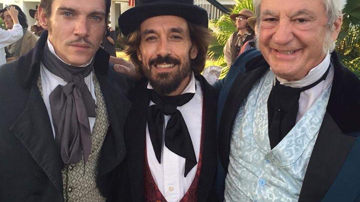 COURTESY MARCO ST. JOHNMarco St. John, right, will appear in the third episode of 'Roots' that airs this week on the History Channel. St. John will play a gambler at a cockfight in Wednesday night's segment. With him in the photo are actors Jonathan Rhys Meyers, left, and George Villas.