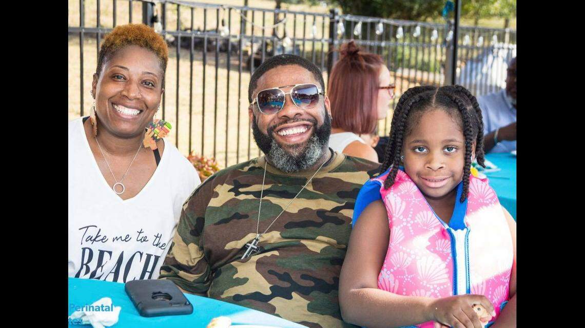 Parker, 53, is pictured with his wife, Catina McGahee Parker, and their daughter.