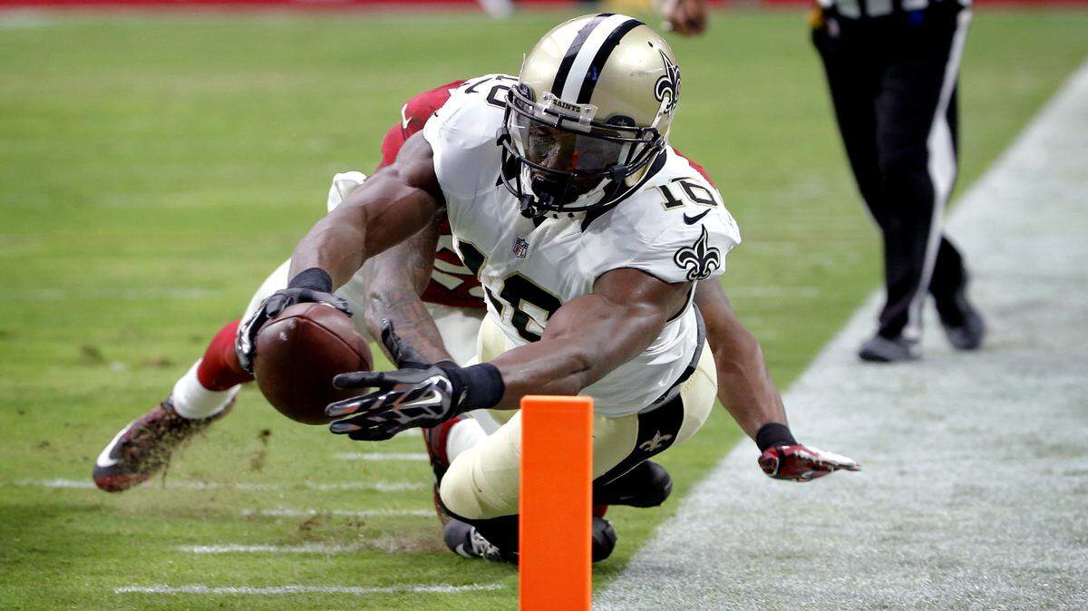 New Orleans Saints wide receiver Brandon Coleman (16) dives in for a touchdown as Arizona Cardinals strong safety Deone Bucannon defends during the first half of an NFL football game, Sunday, Sept. 13, 2015, in Glendale, Ariz. (AP Photo/Ross D. Franklin)