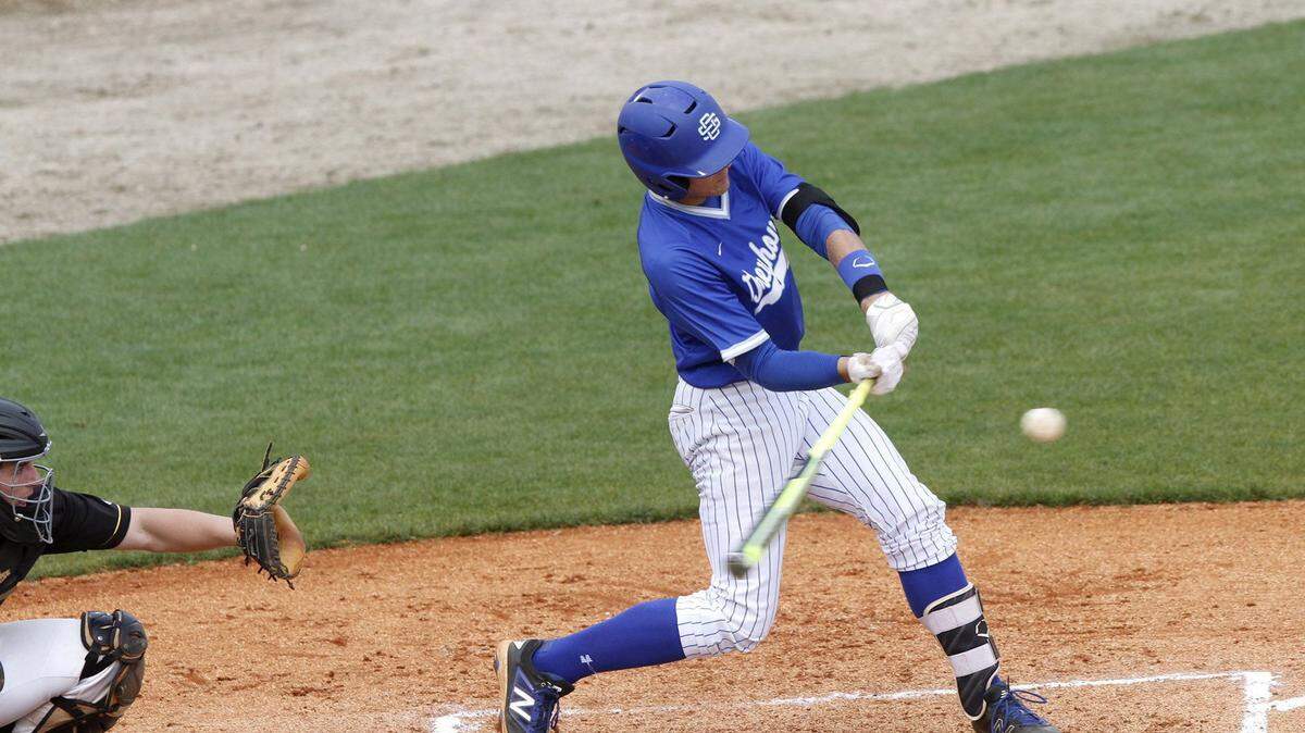 TIM ISBELL/SUN HERALD 
 Ocean Springs third baseman Drew Windham knocked in four runs to lead the Greyhounds to a victory over Oak Grove, Saturday, March 26, 2016.