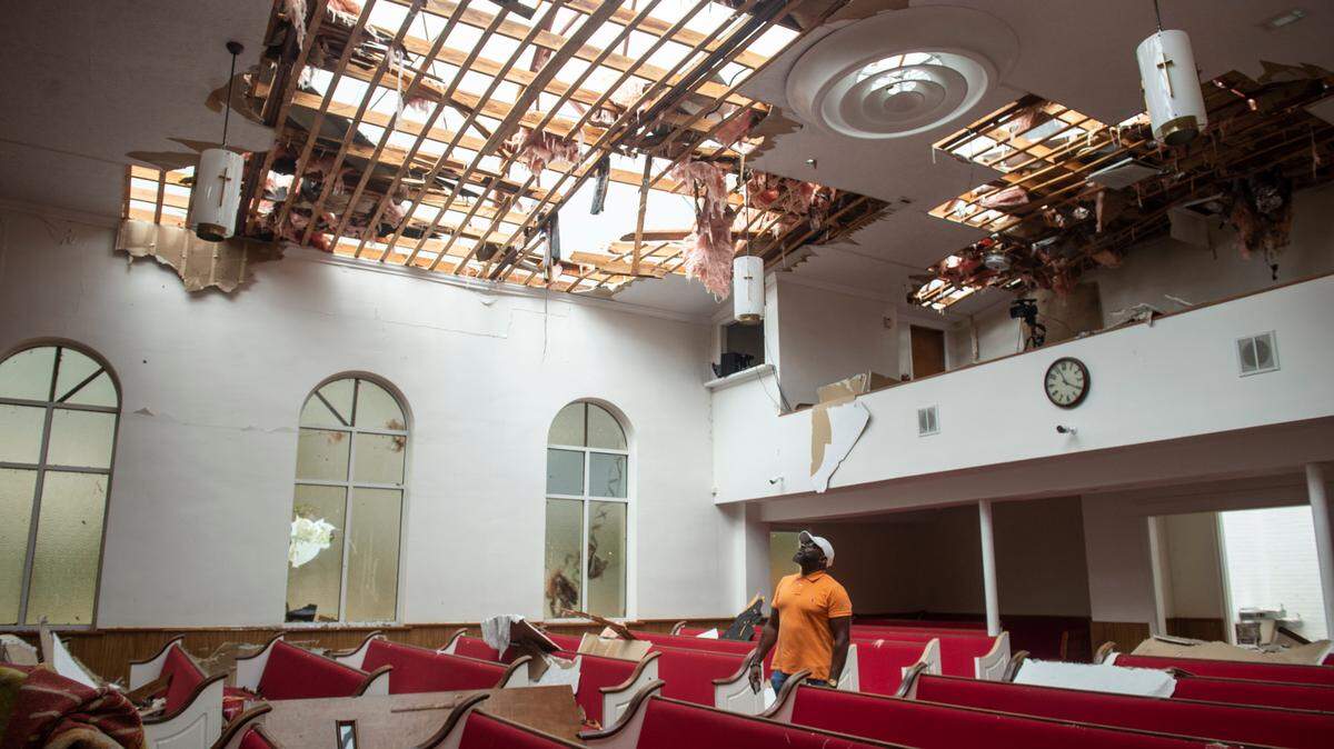 The Rev. Kevin L. Henry Sr. inside First Baptist Missionary Church in Moss Point on Tuesday, June 20, 2023, after a tornado tore the roof off the building.