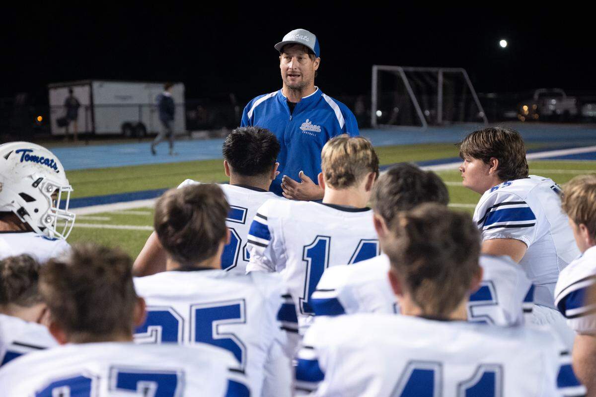 Stone head coach Jacob Aycock speaks to his team Friday after a win over Vancleave.