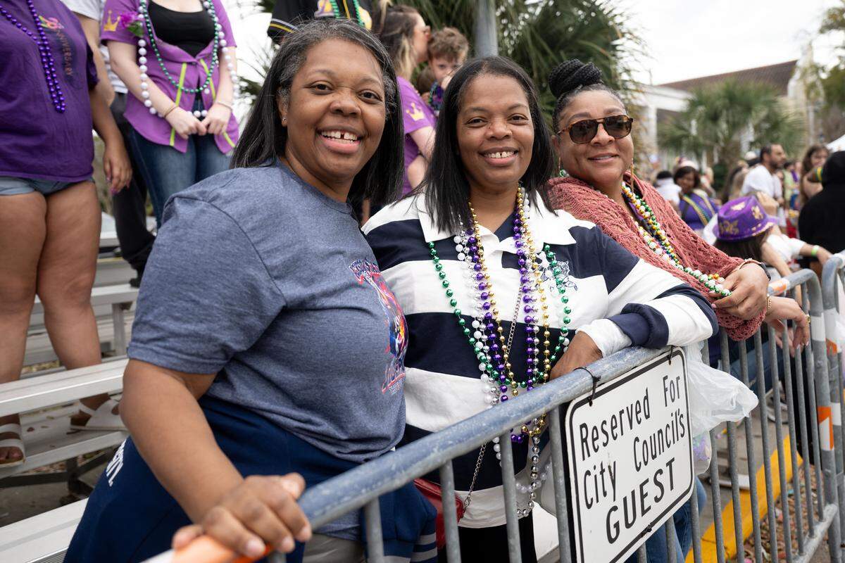Members of the crowd pose for a photo.