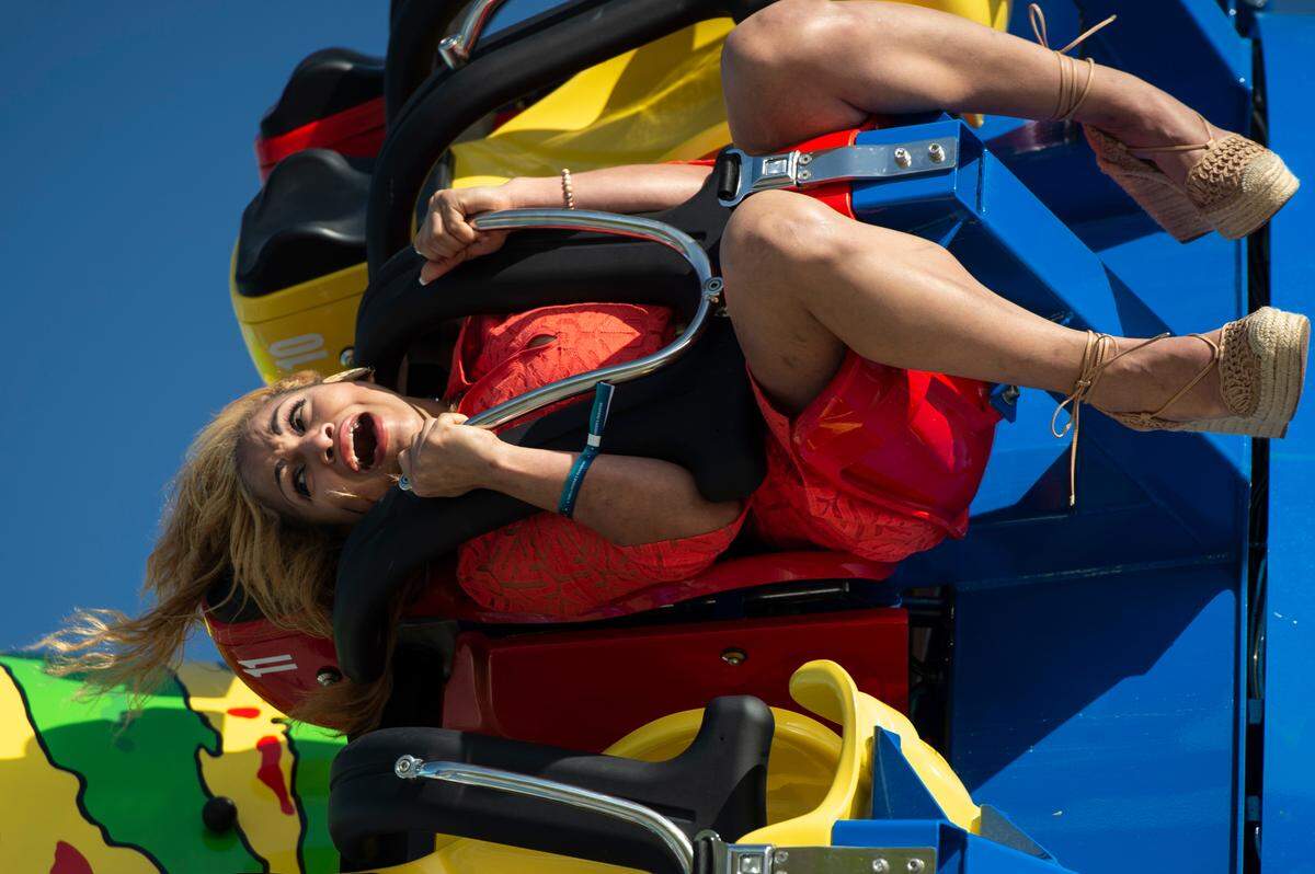 DJ Palmer, of Biloxi, rides the Storm Surge ride during the grand opening of Paradise Pier amusement park at Margaritaville in Biloxi on Friday, March 3, 2023.