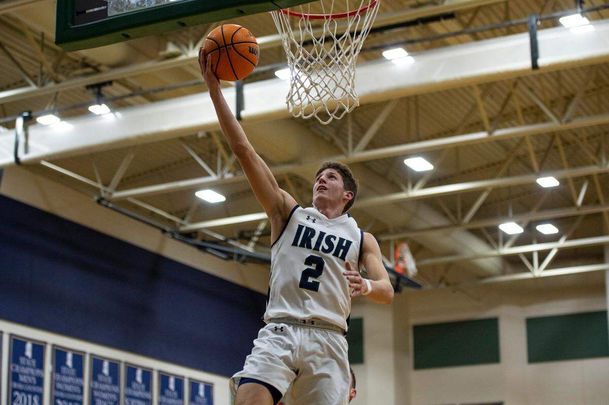 St. Patrick guard Nick Krass scores during a game against Perry Central at St. Patrick Catholic High School on Thursday, Jan. 13, 2022.