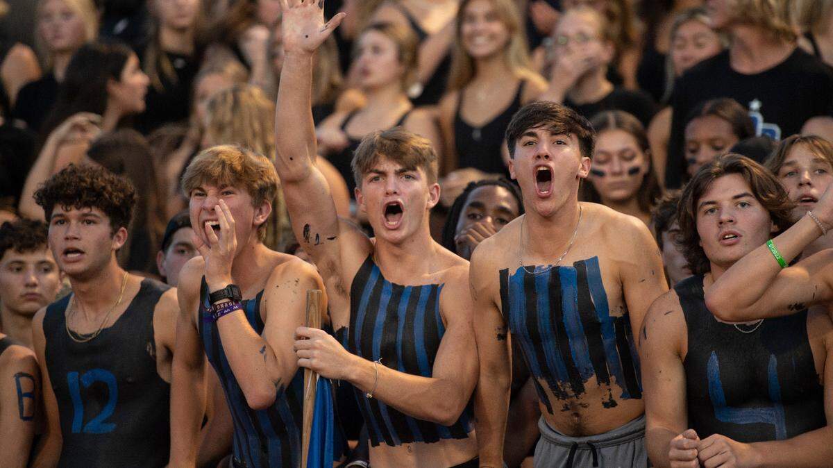 The Ocean Springs student section cheers on their team during a Jamboree game against Gautier at Greyhound Stadium in Ocean Spring on Friday, Aug. 19, 2022.