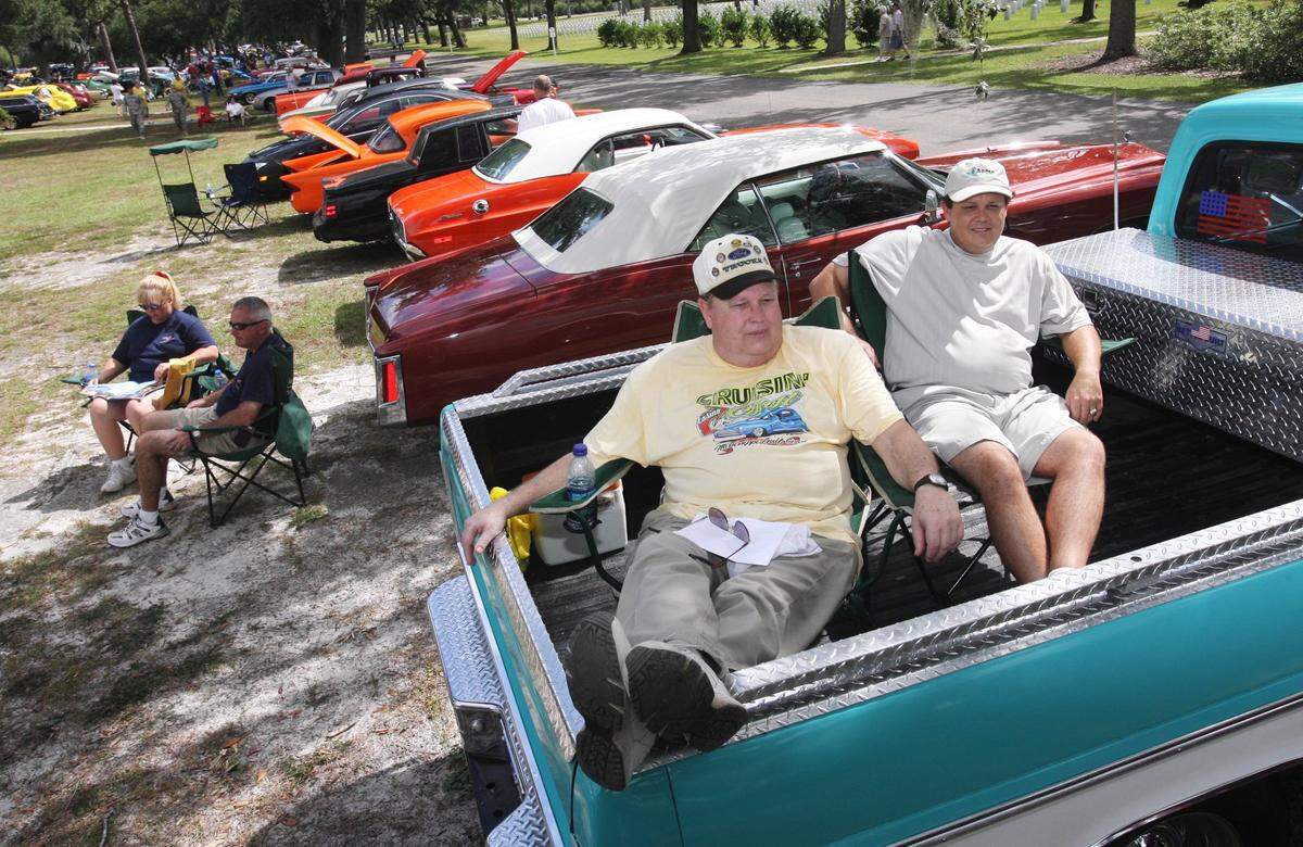 Robert Page of Gulfport and his son, Scott, watch the cars from the back of Robert’s 1968 Ford F-100 pickup in 2008 during the Cruisin’ the Coast event at the Biloxi Veterans Affairs Medical Center campus.