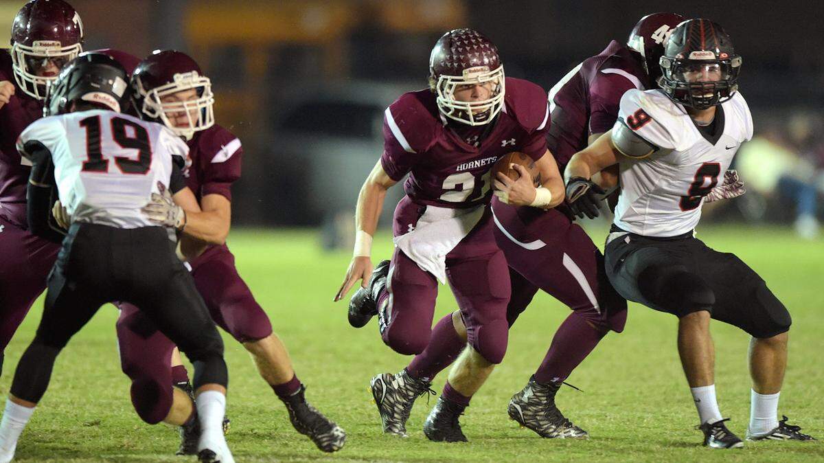 GLENN ANDREWS/SPECIAL TO THE SUN HERALD 
 East Central running back A.J. Davis, center, led the coast in rushing this season. The senior gashed teams for 2,893 yards and 25 touchdowns on 437 carries.