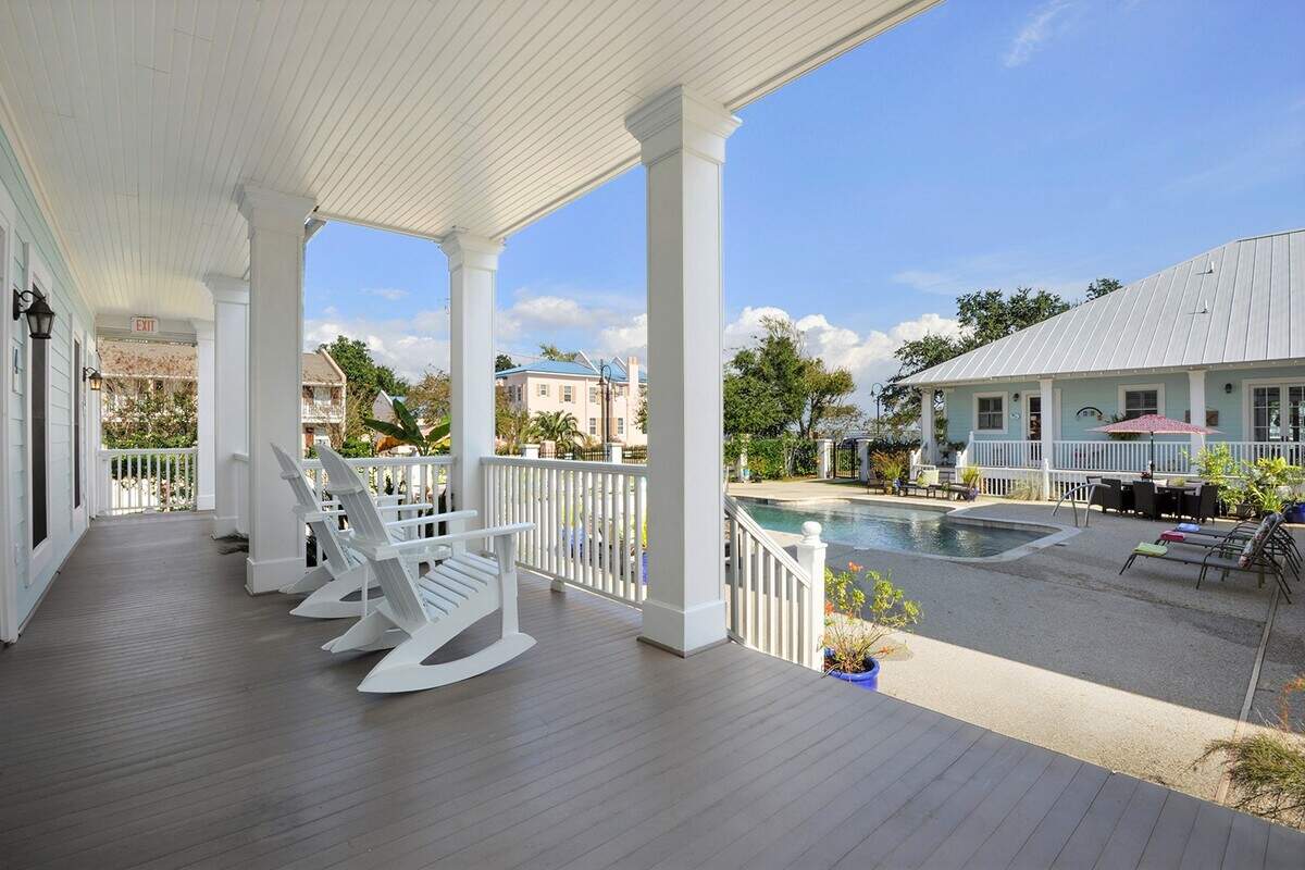 Chairs overlooking the pool await couples who book a get-away at Bay Town Inn at Bay St. Louis, one of Southern Living’s most beautiful Southern beach towns..