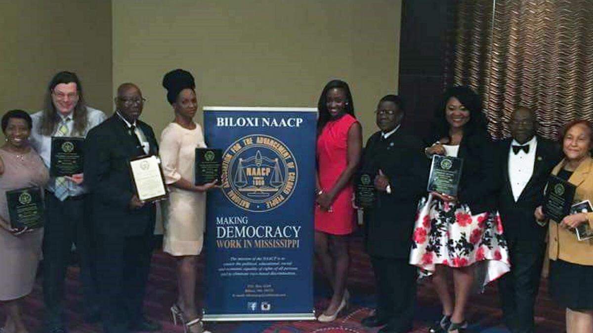 GORDON JACKSON/SPECIAL TO THE SUN HERALD 
 From left, award recipients Dr. Persharon Dixon, Renick Taylor, Terry Henderson, Dawn Stough, Esq., Kendra Turley, Lawrence Wheaton, Ja'Leasa Walden, Herschell Pargo and Carolyn Perry.