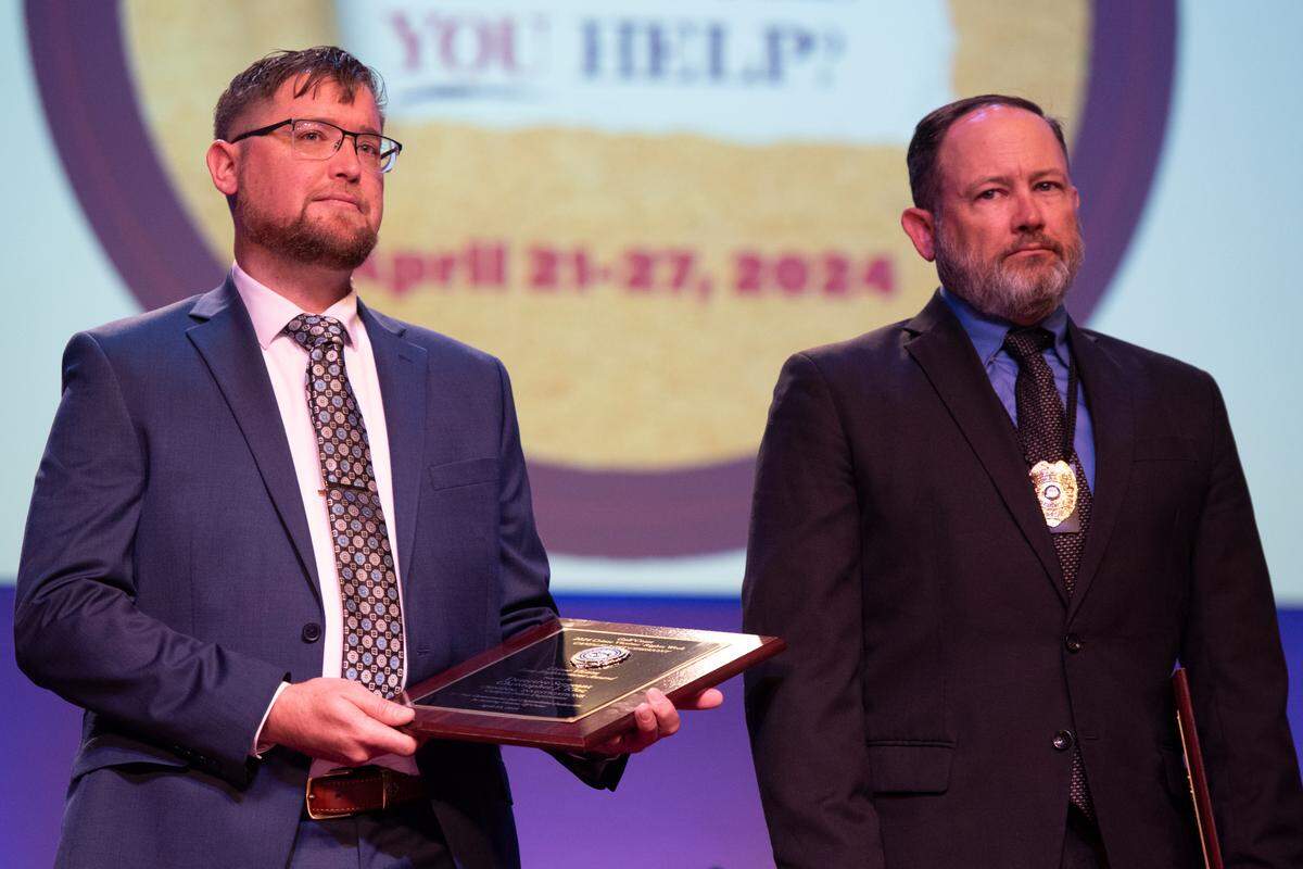 Detective Sergeant Christopher J. Kloc with the Gulfport Police Department and Detective Sergeant Brad Gross with the Long Beach Police Department receive the Crime Victim Law Enforcement Award for their work on the murder case of Ashley Barbara during a candlelight ceremony as a part of National Crime Victims’ Rights Week at First Baptist Church of Gulfport on Tuesday, April 23, 2024.