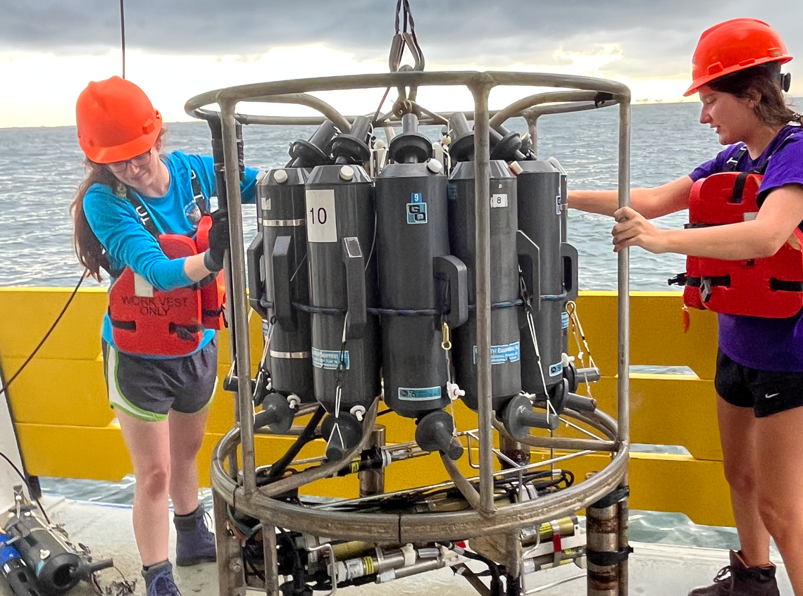 Scientists with the Louisiana Universities Marine Consortium prepare to launch a device that measures conductivity, temperature, and depth during the 2023 Gulf of Mexico “dead zone” research cruise.