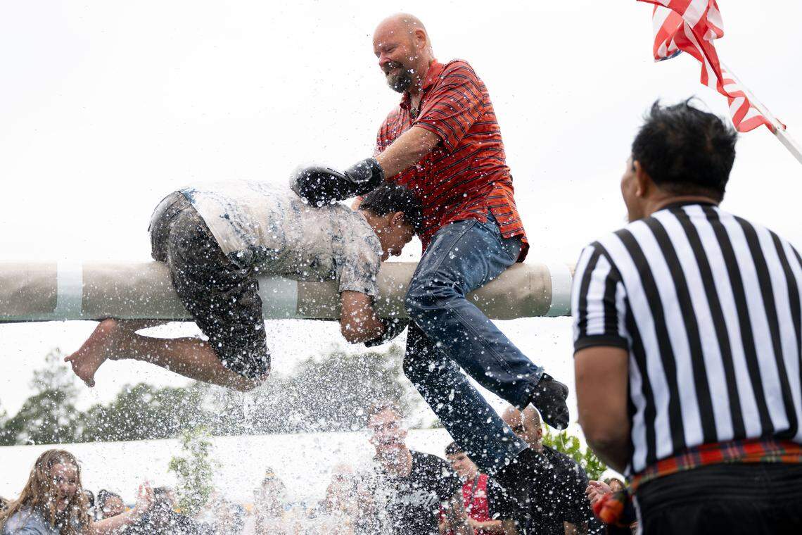 Attendees participate in Thai water boxing during Songkran at the Wat Buddhametta Mahabaramee in Gautier on Sunday, April 19, 2026.