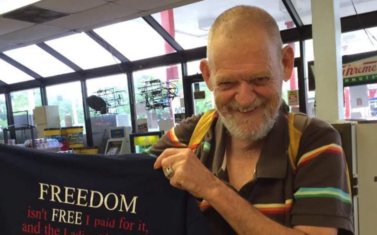 COURTESY BROOKLYN COMPTON
William, a regular customer at Dolly's Quick Stop, is presented with a shirt honoring his service on Veteran's Day 2016.