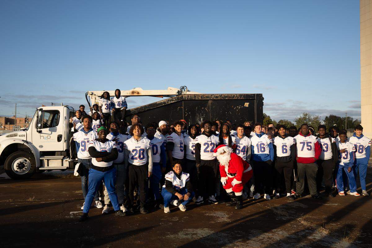 The Gulfport football team poses for a team photo during the Champions Christmas Parade in Gulfport on Monday, Dec. 8, 2025.