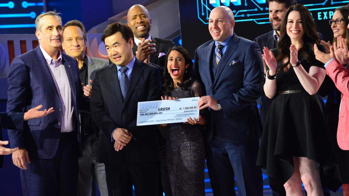 Tommy Baynard/Intel CorporationContestants and judges celebrate during the finale of 'America's Greatest Makers,' an Intel-funded reality show on TBS. Front row, from left: Brian Krzanich, Intel CEO and show judge; Yongjing Wang, Team Grush; Dr. Anubha Sacheti, Team Grush; Ethan Schur, Team Grush; and Carol Roth, show judge. Back row, from left: Mike Rowe, guest judge; Kenny Smith, guest judge; Jonathan Schaffer, Team ASEAH; and Aleda Schaffer Team ASEAH.