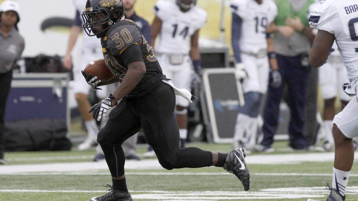 TIM ISBELL/SUN HERALD 
 Southern Miss running back Jalen Richard runs for a first down against Old Dominion on Nov. 21 in Hattiesburg, Saturday, Nov. 21, 2015.