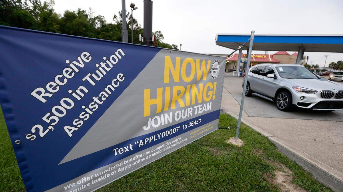 This June 21, 2019, photo shows a “now hiring” sign at a McDonald’s restaurant in Moss Point, Miss. On Wednesday, July 3, payroll processor ADP reports how many jobs private employers added in June.