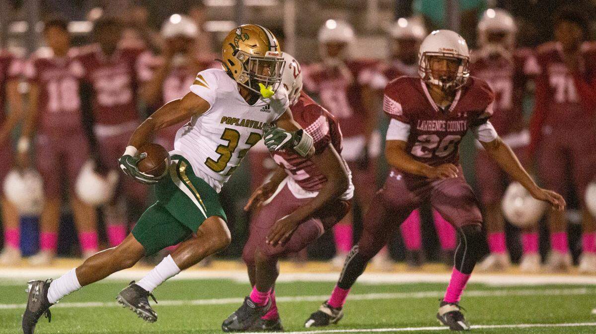 Poplarville’s Benny Jarvis runs the ball down the field for a touchdown during a game against Lawrence County at Poplarville High School in Poplarville on Friday, Oct. 7, 2022.