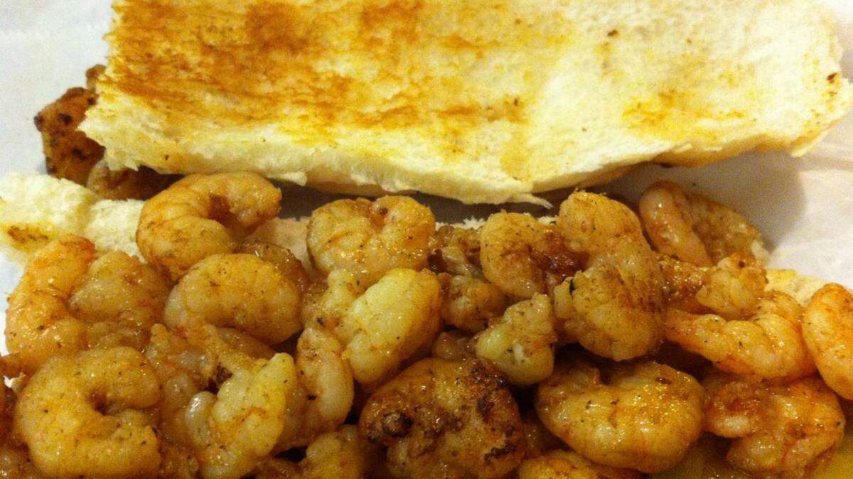 JOHN BIALAS/SUN HERALD
Imagine grilled shrimp from a po-boy in a king cake.