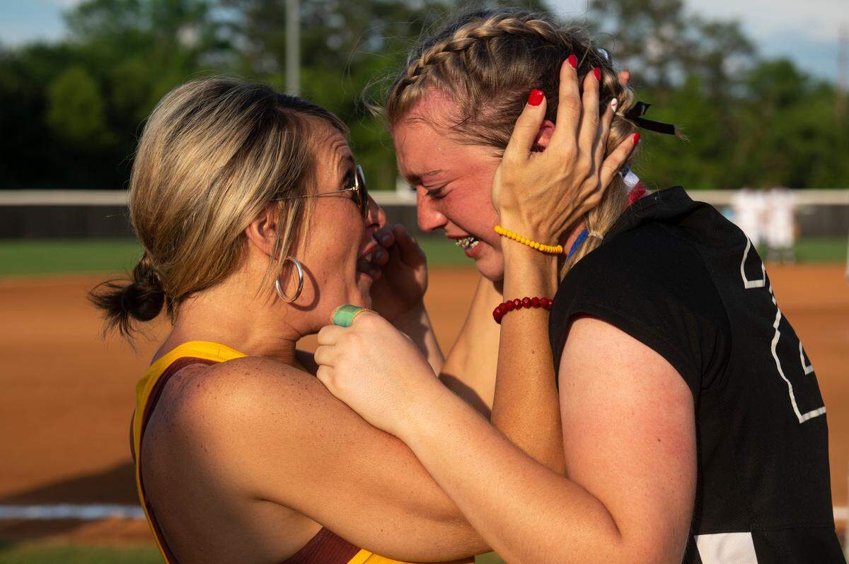 George County Lady Rebels’ Kyleigh Howell hugs a family member after winning the 5A 2023 MHSAA Softball Championship game at USM Softball Complex in Hattiesburg on Thursday, May 18, 2023.