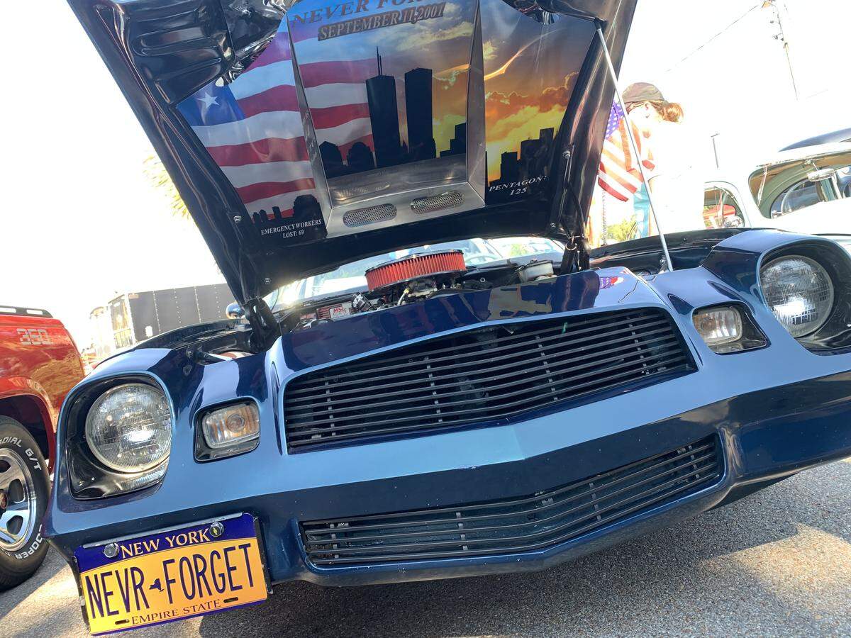 A salute to 911 is painted under the hood of this car at Cruisin’ The Coast 2024.