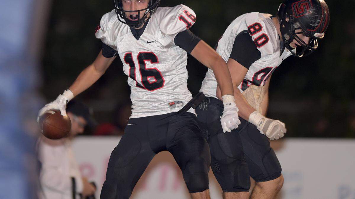GLENN ANDREWS/SPECIAL TO THE SUN HERALD 
 St. Stanislaus wide receiver Corbin Blanchard (16) celebrates a touchdown against Moss Point with tight end Chase Rogers (80) during the first quarter, Friday, Nov. 20, 2015, in Moss Point, Miss.