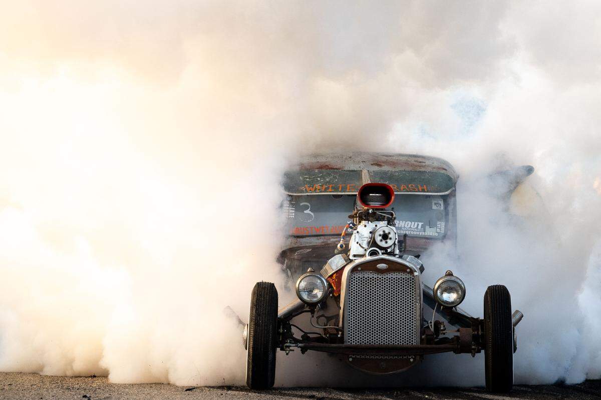A car kicks up smoke during Burn ‘Em Up In The Pass on Thursday, Oct. 9, 2025.