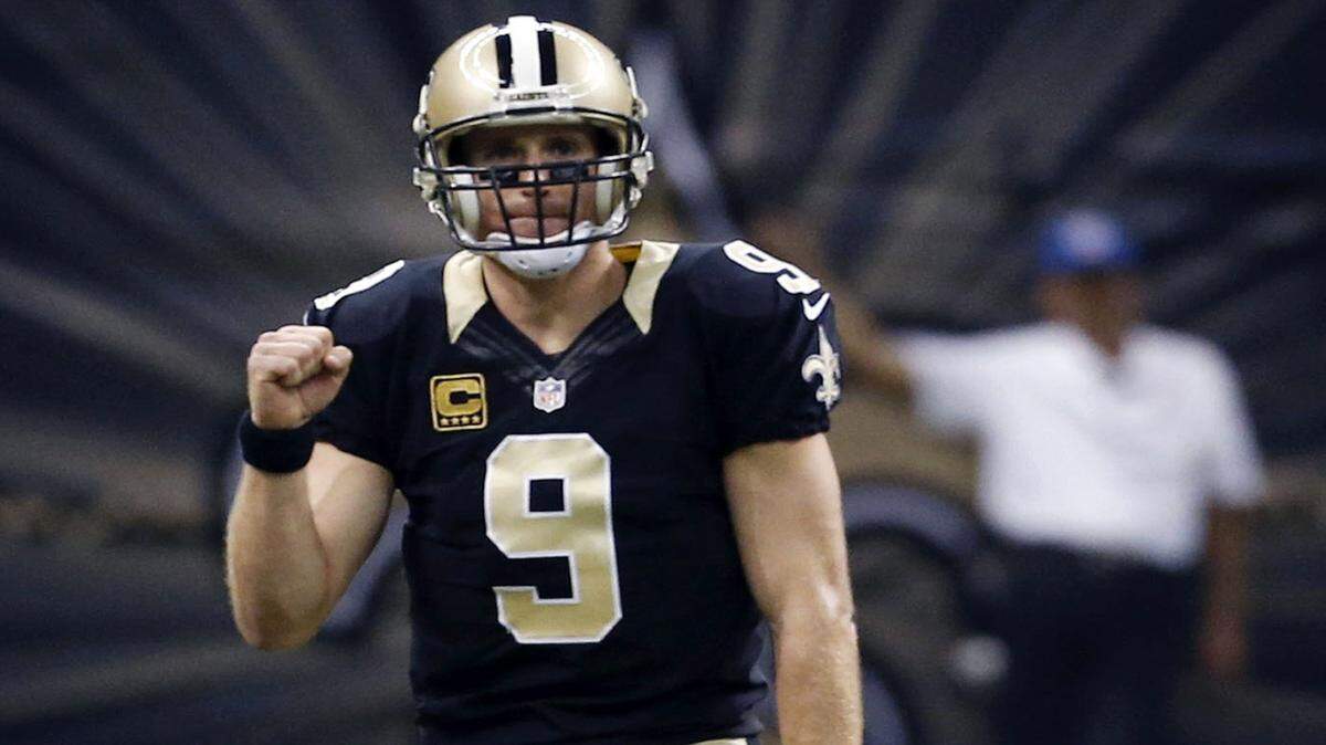 New Orleans Saints quarterback Drew Brees (9) reacts after throwing a touchdown pass to wide receiver Brandin Cooks in the first half of an NFL football game against the Jacksonville Jaguars in New Orleans, Sunday, Dec. 27, 2015. (AP Photo/Jonathan Bachman)