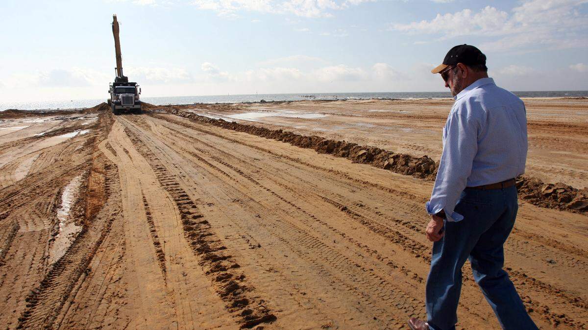 TIM ISBELL/SUN HERALD 
 W. C. Fore walks along the west pier of the State Port at Gulfport in 2009.