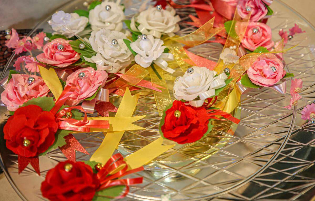During the Le Vu Lan service worshipers took and placed a polyester rose pin to their chest. Red symbolized that the wearer’s parents are still living, white that their parents have died, pink that one parent is living and another has passed away. August 29, 2020.