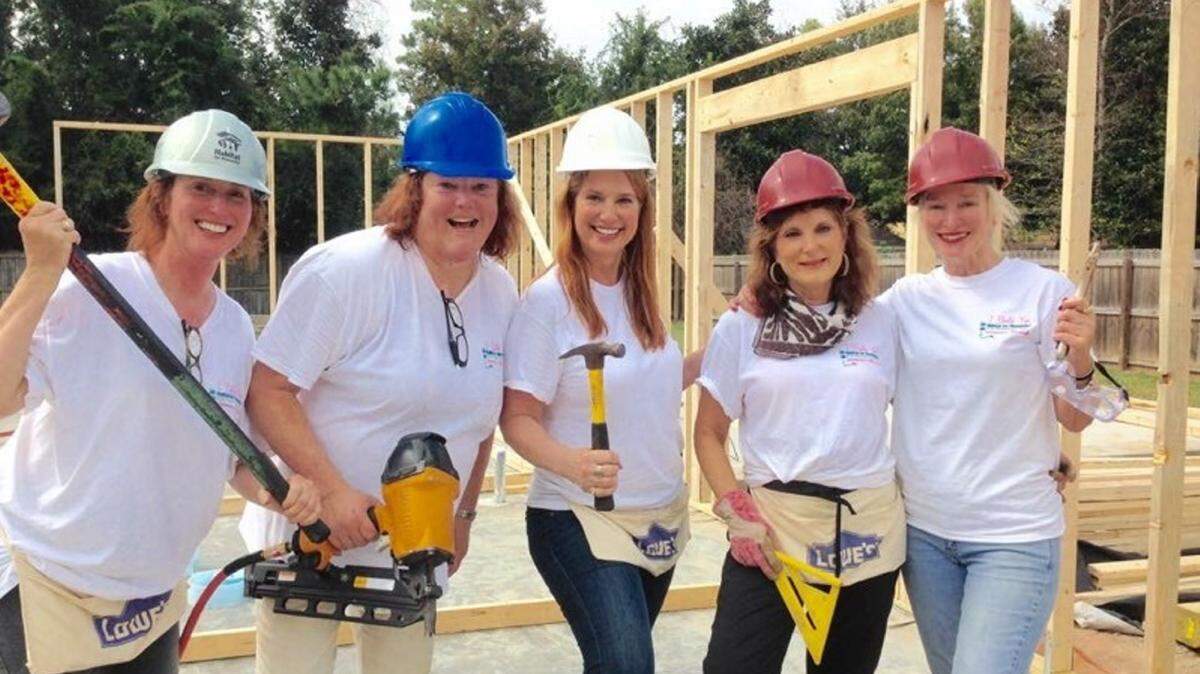 COURTESY CONNIE MORANBecky Feder, second from left, working on last month's Habitat for Humanities project with Paige Riley, left, Connie Moran, center, Ginny Conn and Lisa Segarra.