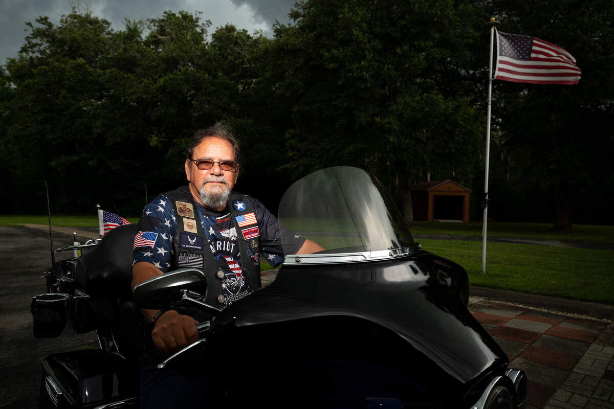 Steve Carrington poses on the motorcycle he will use to bring the American flag from Biloxi to Slidell for his leg of the Patriot Tour on Monday, July 6, 2026.
