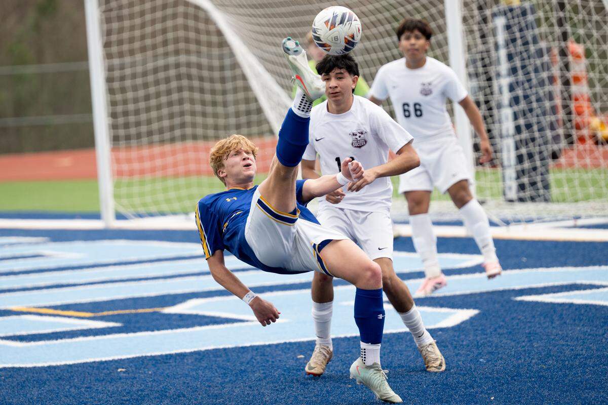 Bay High’s Mason Bosarge bicycle kicks the ball during the 4A boys soccer state championship game at Ridgeland High School in Jackson on Feb. 21, 2026.