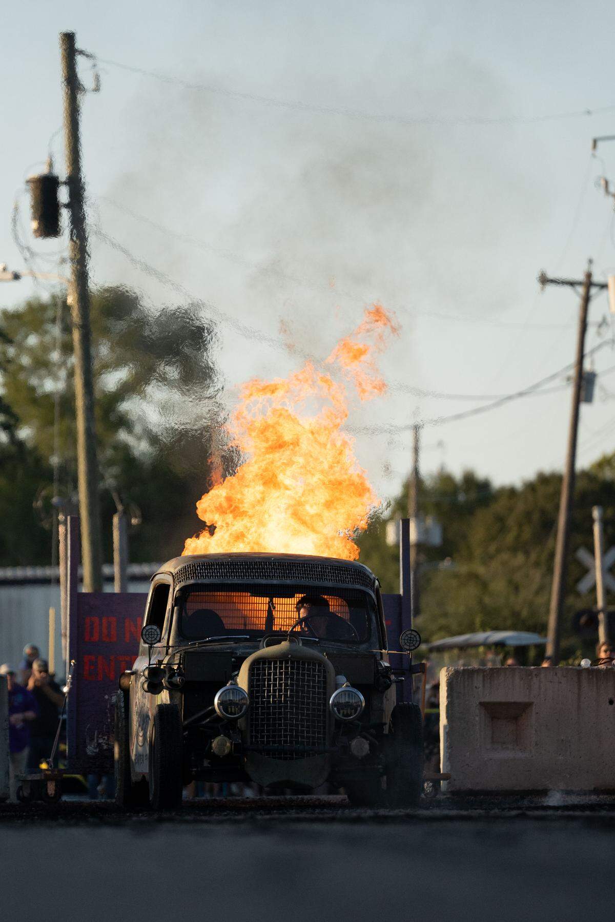 A modified vehicle shoots out fire during Burn ‘Em Up In The Pass on Thursday, Oct. 9, 2025.