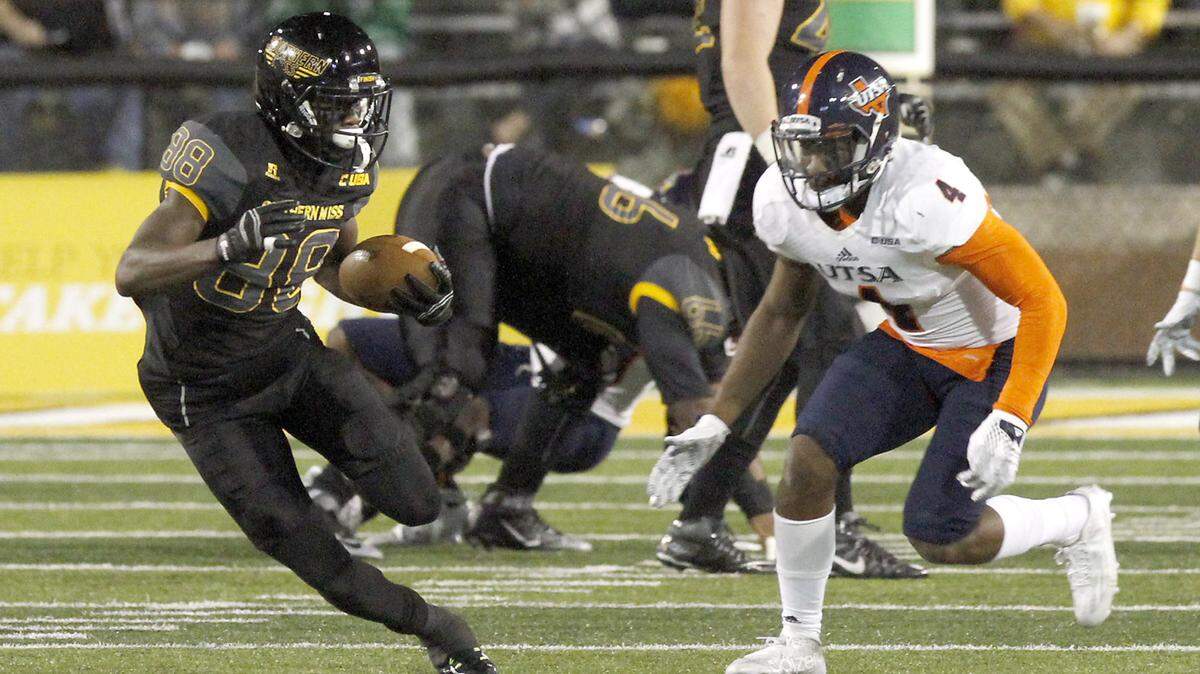 TIM ISBELL/SUN HERALDSouthern Miss receiver Mike Thomas runs for a first down after catching a Nick Mullens pass, Saturday, Oct. 17, 2015. 