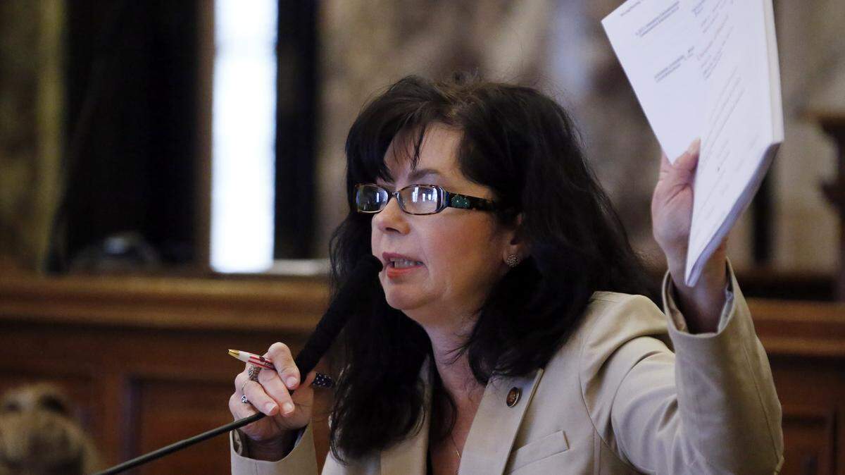 Sen. Angela Hill, R-Picayune, waves paperwork during debate at the Capitol in Jackson in 2014. She has filed Senate Bill 2174, which would allow prosecutors to pursue up to 10 counts of animal cruelty and felony charges on a first offense(AP Photo/Rogelio V. Solis)