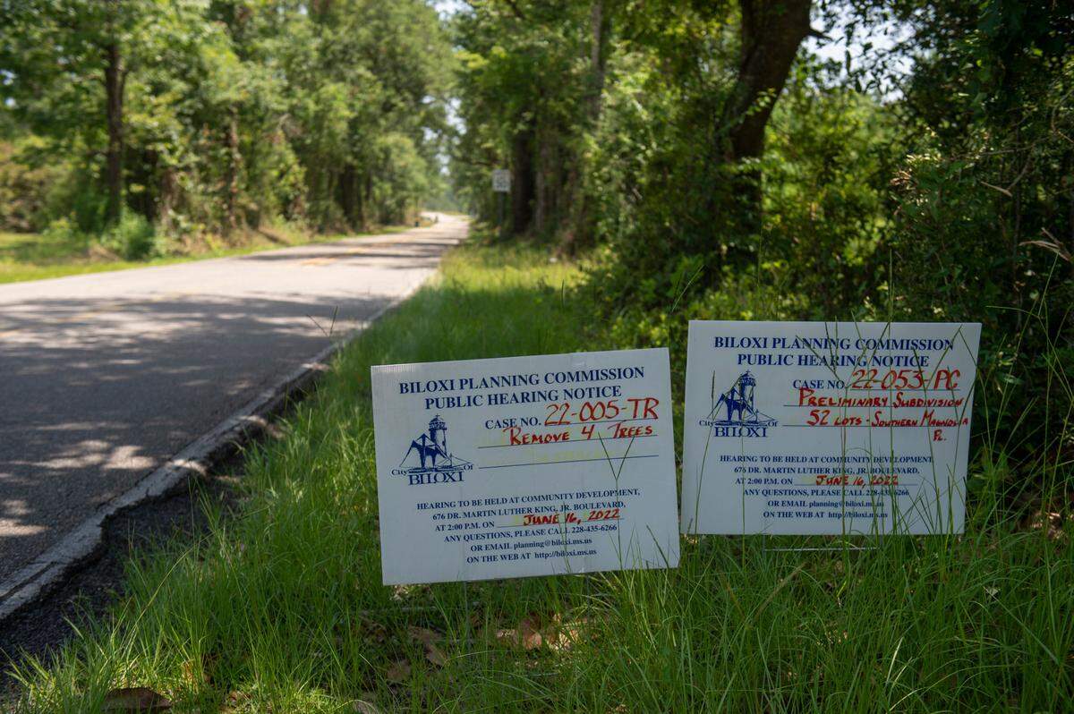 Signs advertising a Biloxi Planning Commission public hearing addressing a proposed sub-development sit on the property line of the proposed development on Shorecrest Road in Woolmarket on Thursday, June 16, 2022.