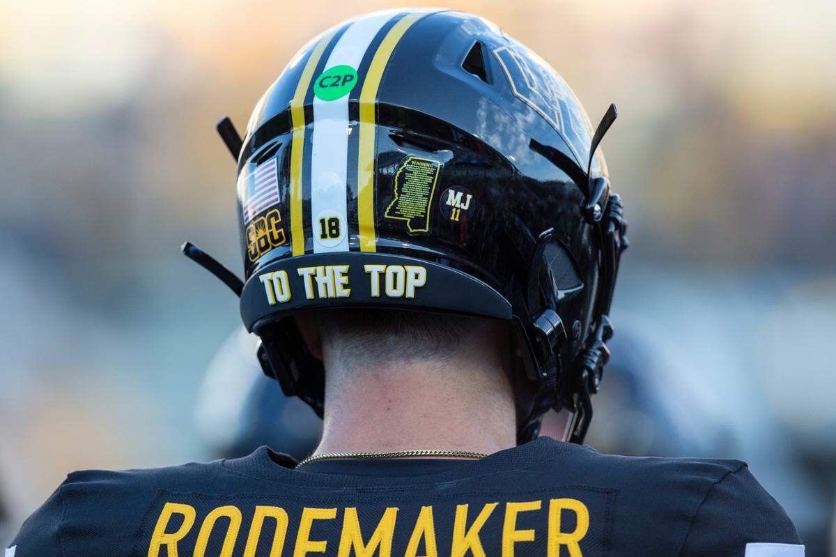 Southern Miss Golden Eagles quarterback Tate Rodemaker (18) wears a sticker on his helmet with the number of MJ Daniels during a game between Southern Miss and Southeastern Louisiana at M.M. Roberts Stadium in Hattiesburg on Saturday, Sept. 7, 2024. Daniels, a former teammate, was shot and killed earlier this year.