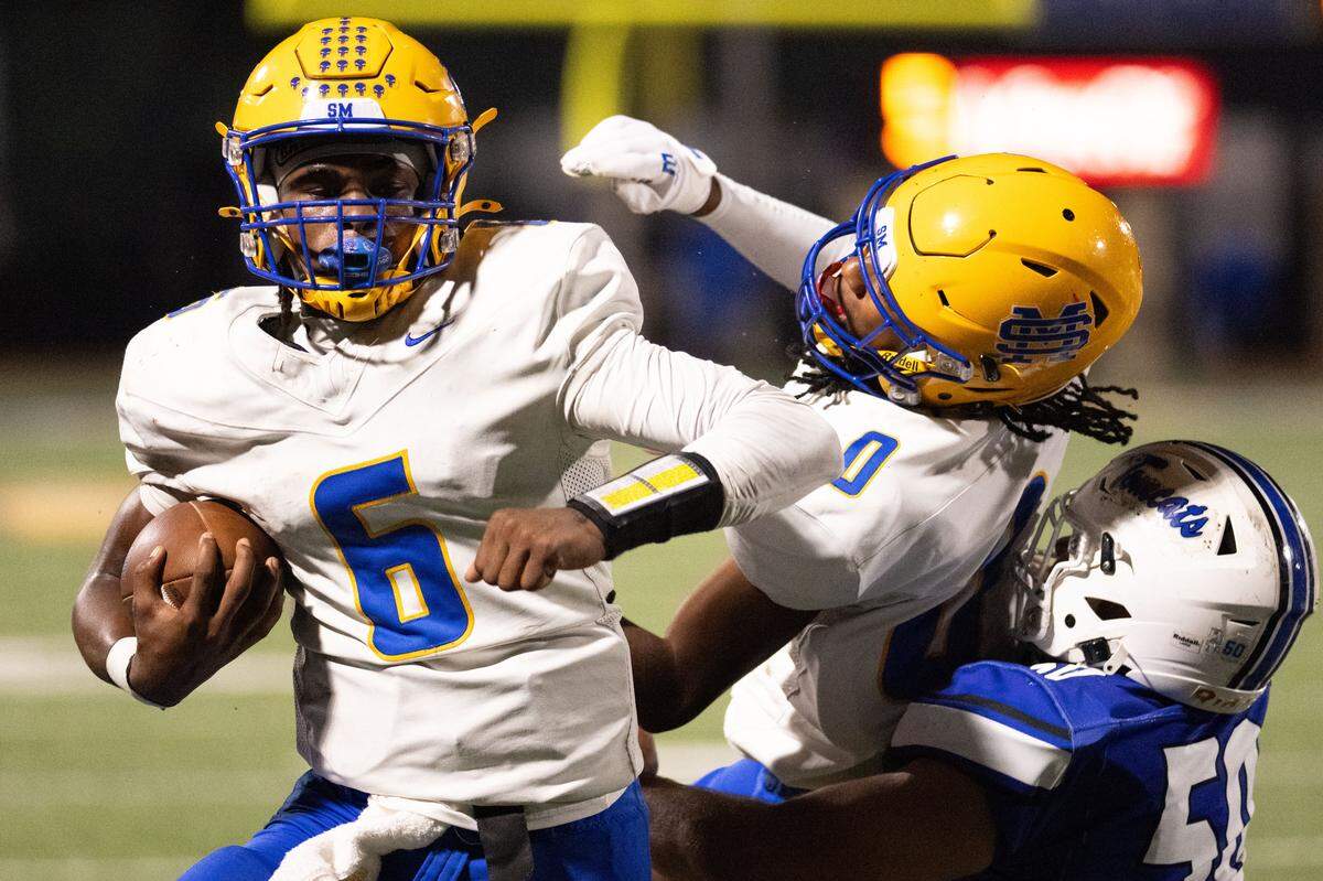 St. Martin quarterback Seth Crockett (6) scored all three of St. Martin’s touchdowns Friday in a 21-3 win over Stone.