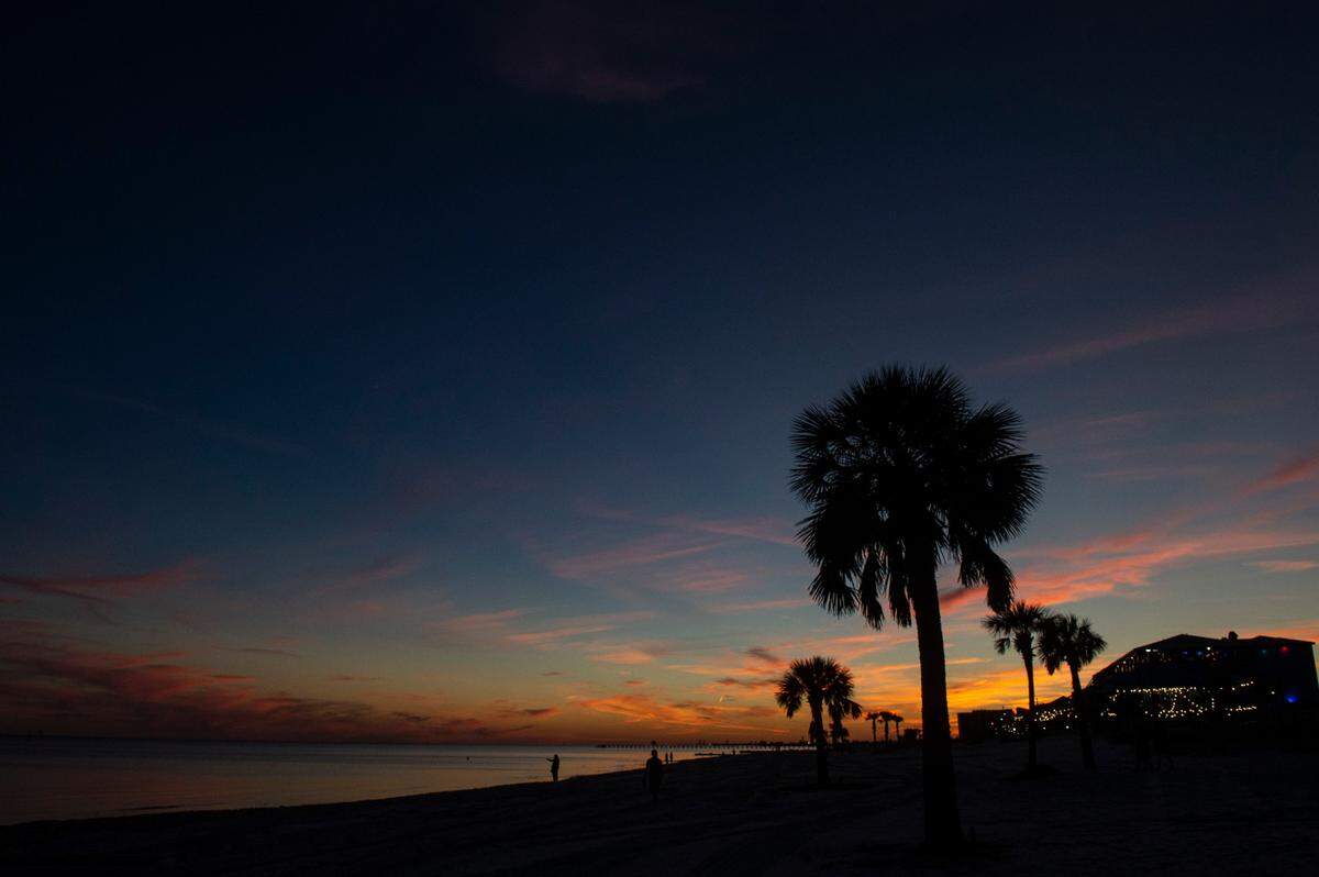 The sun sets on Biloxi Beach in Biloxi on Wednesday, Sept. 22, 2021.