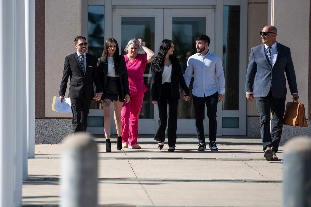 Robert Deming III, left, his attorney, W. Fred “Dub” Hornsby, right, and Deming’s family members leave Dan M. Russell Jr. Federal Courthouse in Gulfport on Wednesday, May 1, 2024, after Deming pleaded guilty to selling products containing synthetic cannabinoids at his Candy Shop kratom stores.
