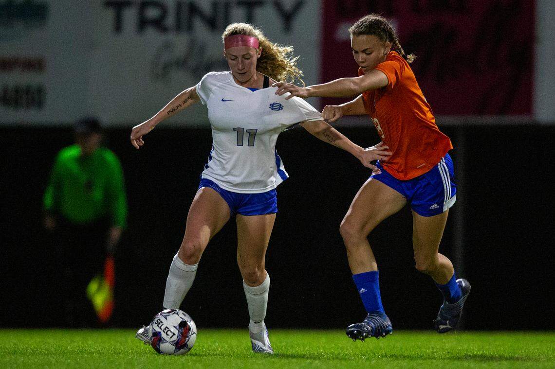 Gulfport’s Abigail Badurak and Ocean Springs’ Parker St. Amant fight for the ball during the 6A South State Championship game in Gulfport on Tuesday, Jan. 31, 2023.
