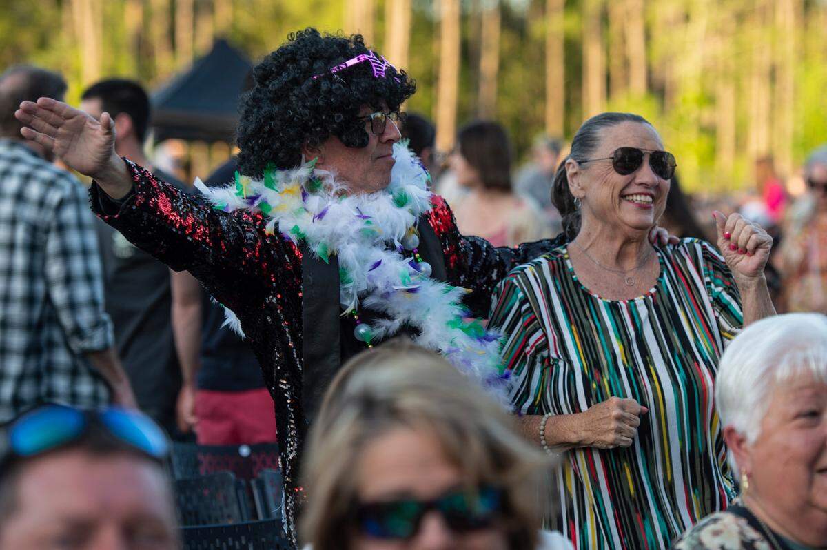 Fans dance before the start of the KC and The Sunshine Band concert at The Sound Amphitheater in Gautier on Friday, April 12, 2024. The show marks the multi-million dollar venue’s inaugural show.