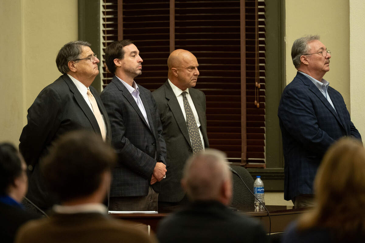 From left to right, Attorney Donald Rafferty, Alan Moran, Attorney H.H. “Tracy” Klein and Philip Moran stand to hear the jury’s verdict during the Morans’ trial.