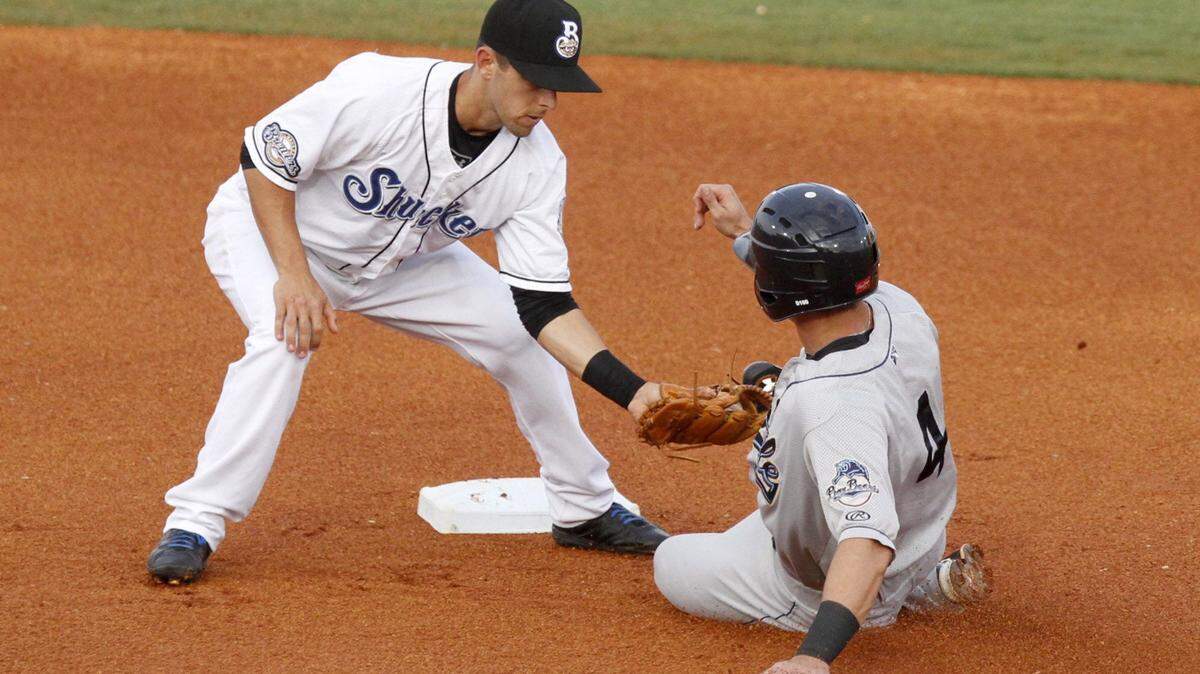 TIM ISBELL/SUN HERALD 
 Shuckers second baseman Nick Shaw tags Mobile's Jack Reinheimer, Wednesday, June 10, 2015.