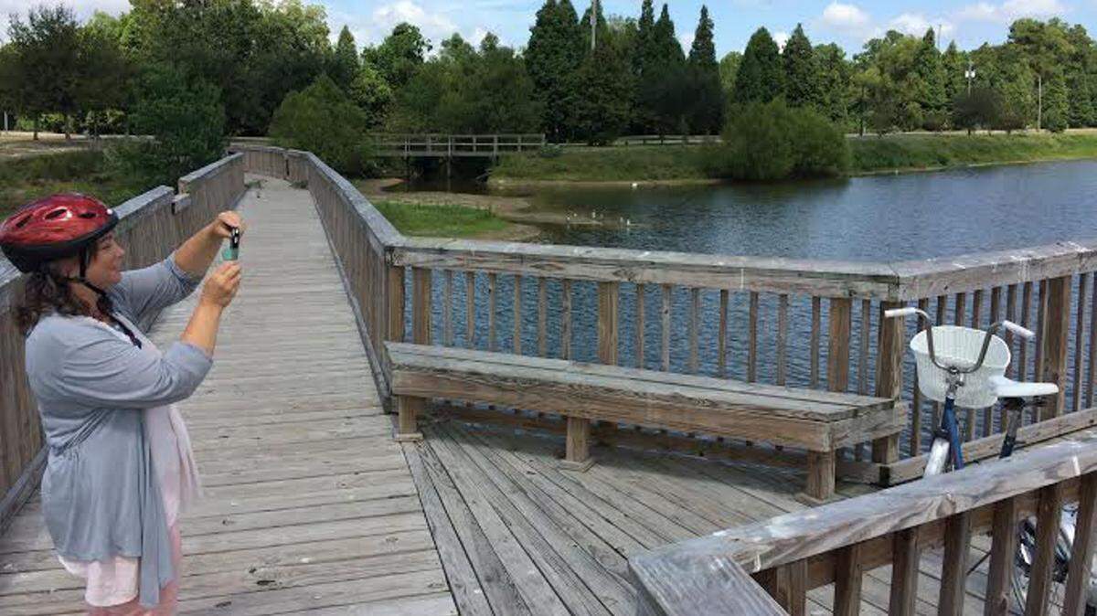 Bethany Carlisle takes a photo of her bike on a pier at I.G. Levy Park North in Pascagoula for her Facebook page in 2014. . The park is one of several the city is considering selling to help make up for a $14 million budged shortfall.
