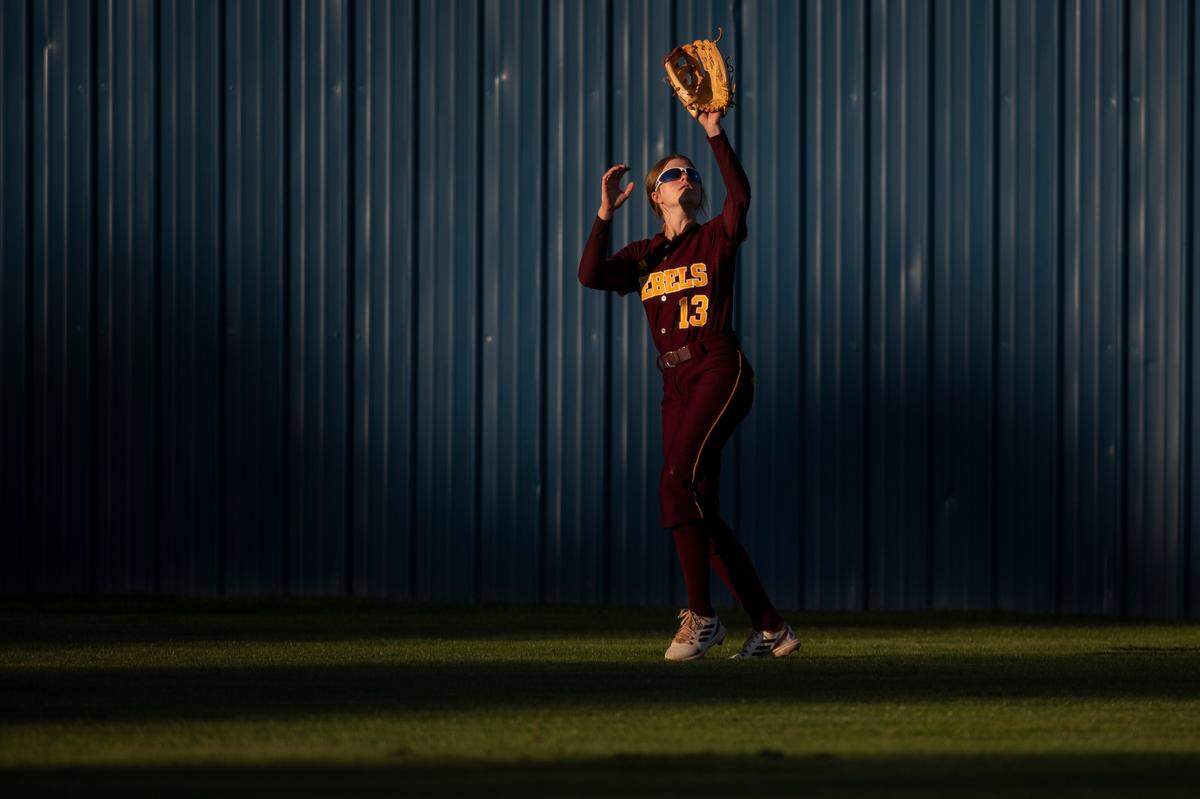 George County’s Kyleigh Howell goes for a catch while warming up before a game at St. Martin on Monday, March 20, 2023.